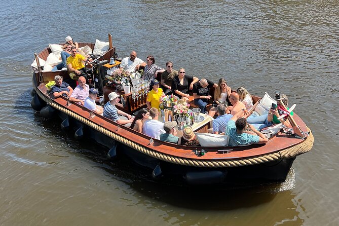 Amsterdam Luxury Boutique Boat tour with Unlimited Beer and Wine - The guide layer: small group size, English, and different personalities