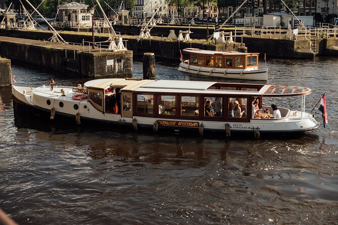 Amsterdam: Luxury Saloon Boat Cruise with Cocktails & Waffle - Cocktails and a waffle: the best kind of Amsterdam shortcut