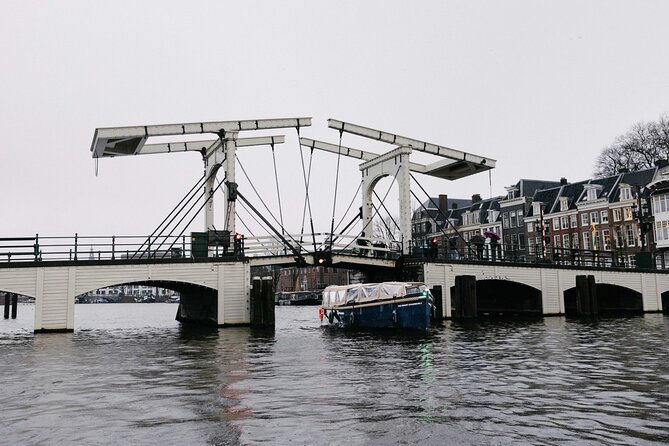 Amsterdam Newest Canal Cruise with local guide and small group - The Amstel River and Blauwbrug: Amsterdam’s name in motion