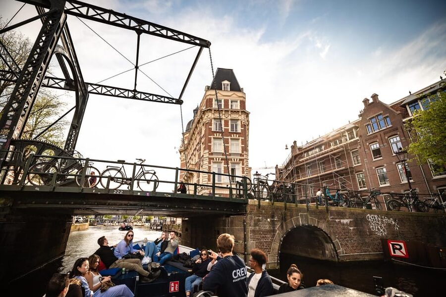Amsterdam:Old City Canal Cruise with Live Guide and Open Bar - The Anne Frank House, Westerkerk, and Jordaan: Why These Names Matter