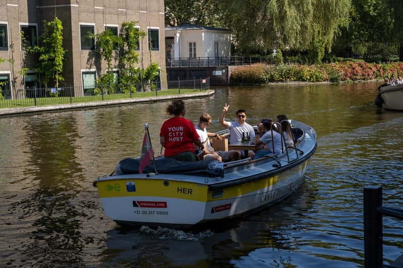Amsterdam: Open Boat Canal Cruise (with Free Spritz Option) - What the live guide adds (and what to be aware of)