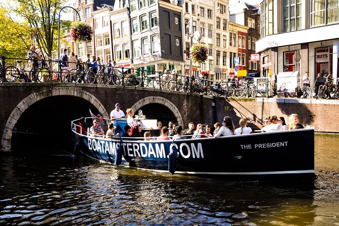 Amsterdam Open Boat Cruise in Old City Centre with Drinks Options - Entering The Cruise: Hermitage Dock Start, Easy Old Town Position