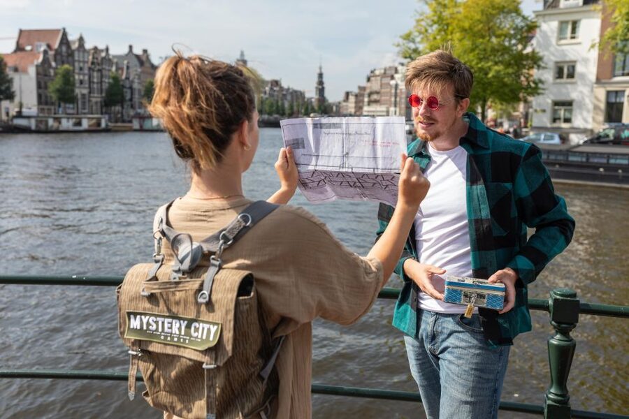 Amsterdam: "Operation 45 " Treasure Hunt Walking Tour - Where it starts: Mystery City Games and your tin-and-map backpack