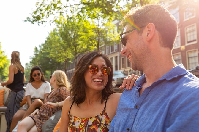 Amsterdam Private Boat Trip with Pizza and Unlimited Drinks - The first stretch: canal-front neighborhoods from a private deck
