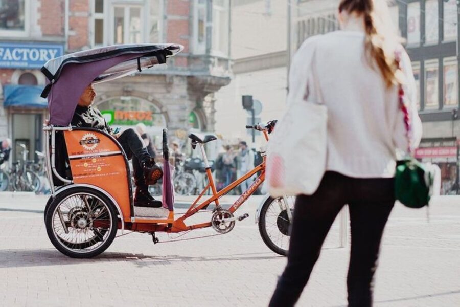 Amsterdam: Private Guided City Tour by Pedicab - Damrak and Dam Square: the postcard start, with context