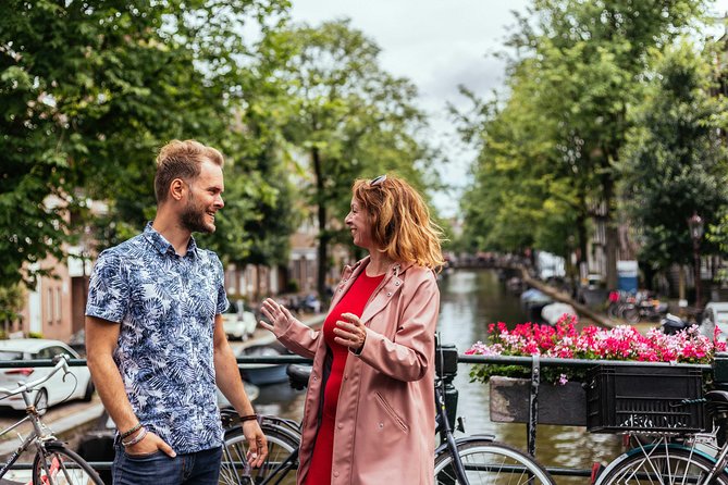 Amsterdam Private Tour: Highlights & Hidden Gems by Bike or Foot - Red Light District stories and quirky Amsterdam facts