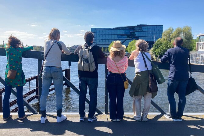 Amsterdam Private Walking Tour with Dinner Experience - Stationsplein and het IJ: starting where Amsterdam keeps moving