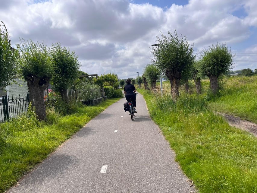 Amsterdam: Rainbow Rural Bike Tour With Local Gay Guide - Stop One: A Centuries-Old Windmill and Its Waterworks Story