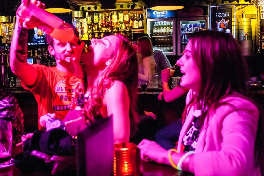 Amsterdam: Red Light District Pub Crawl with Unlimited Shots - Stop by Stop: Four Pubs, Games, and One Included Nightclub