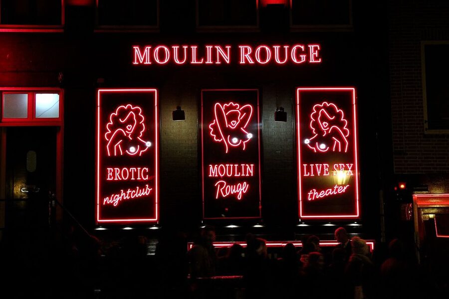 Amsterdam: Red Light District Tour in English or German - Red-Tinted Windows, Neon Signs, and the Rules Behind the Scene