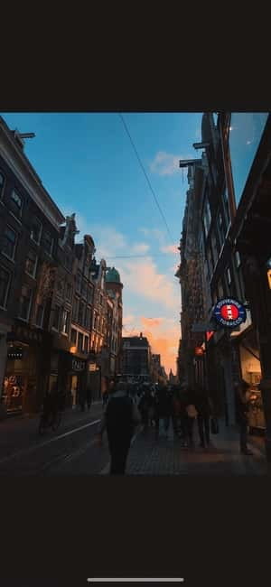 Amsterdam: Red Light District Tour in German/English for groups of 4 or more - Coffee shop stop: learn the weed and drug culture basics without buying