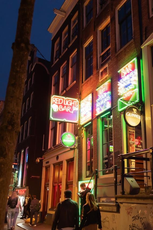 Amsterdam: Red Light Tour Exclusive + Peep Show - Condomerie to Oude Kerk: names, landmarks, and why they matter