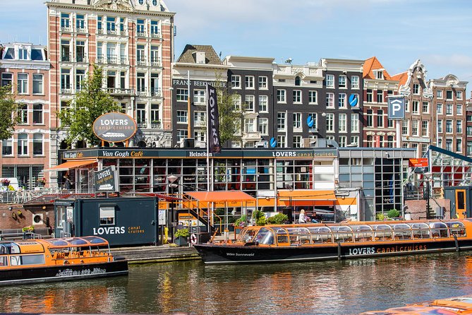 Amsterdam Sightseeing Canal Cruise with Audio Guide - Onboard comfort and audio: headsets, windows, and noise