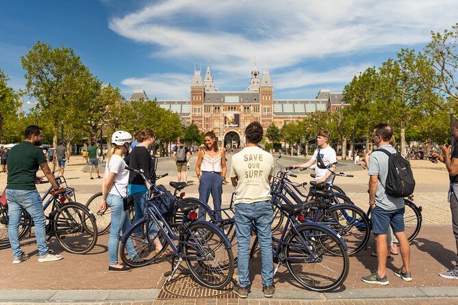 Amsterdam Small-Group Bike Tour With Canal Cruise, Drinks, Cheese - Riding the bridge moments: narrow crossings and the look of Amsterdam