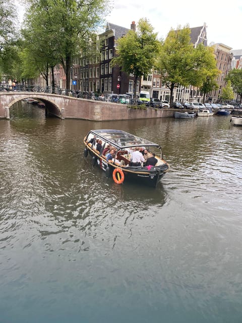 Amsterdam Small Group Canal Cruise inc Snacks/Drinks Winter - Light Festival Nights Without Losing the Real Amsterdam