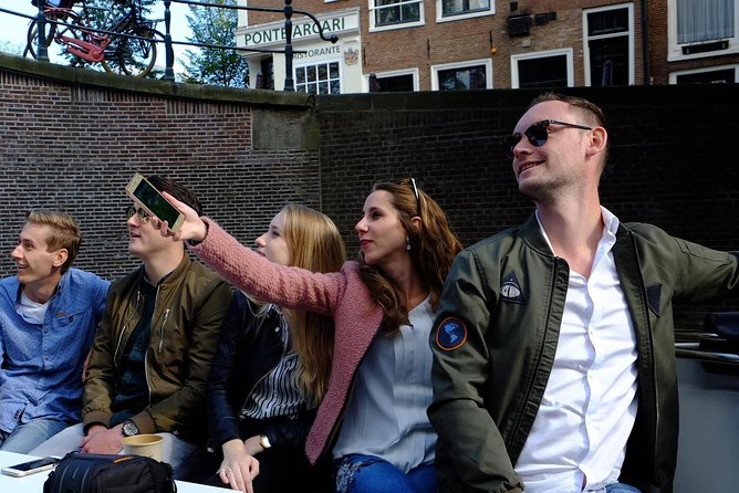 Amsterdam Small-Group Canal Cruise Including Snacks and Drinks - Why this 2-hour electric canal cruise feels like a smarter Amsterdam intro