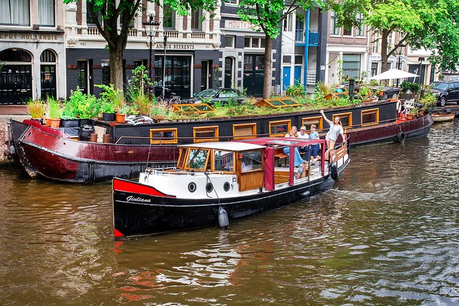 Amsterdam Small-Group Canal Cruise With Dutch Snacks and Drink - Westerkerk and the church stop: a strong landmark anchor on the water