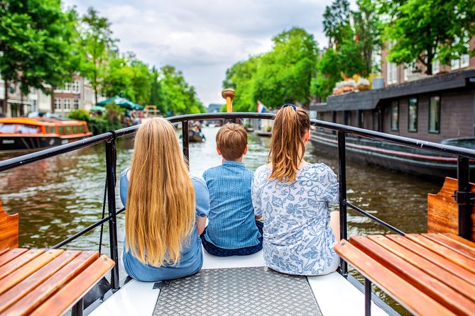 Amsterdam Small-Group Canal Cruise With Dutch Snacks and Drink - Neighborhood variety in two hours: markets, museums, the zoo, and maritime