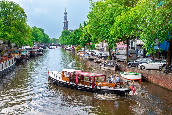 Amsterdam Small-Group Canal Cruise With Dutch Snacks and Drink - Meet Sebi and settle in on a vintage, small, covered barge