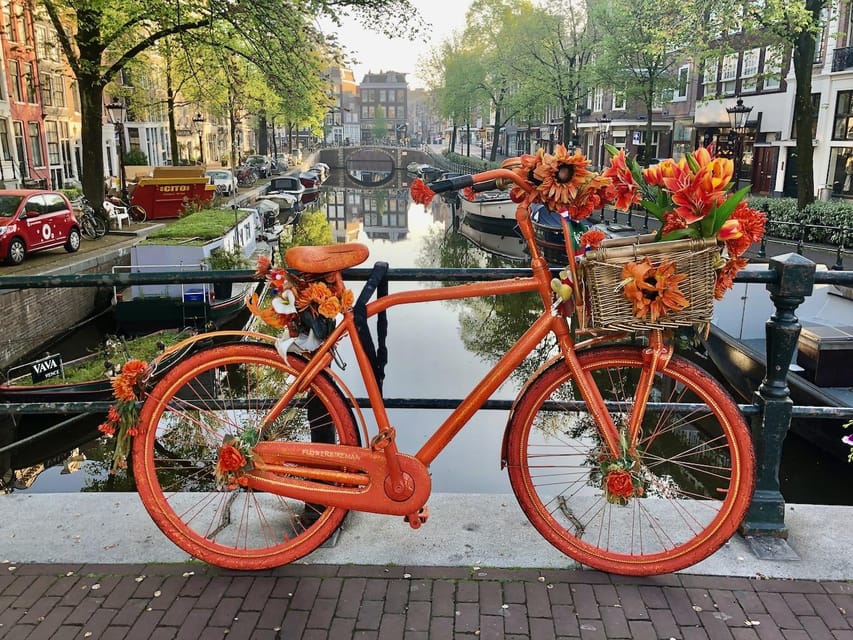 Amsterdam: Small Group Walking Tour with Fun Guide - From fishing village roots to a global city