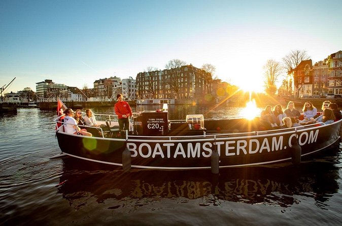 Amsterdam Sunset Canal Cruise with Live Guide and Open Bar - Weather and comfort: open boats, covered boats, and heated seats