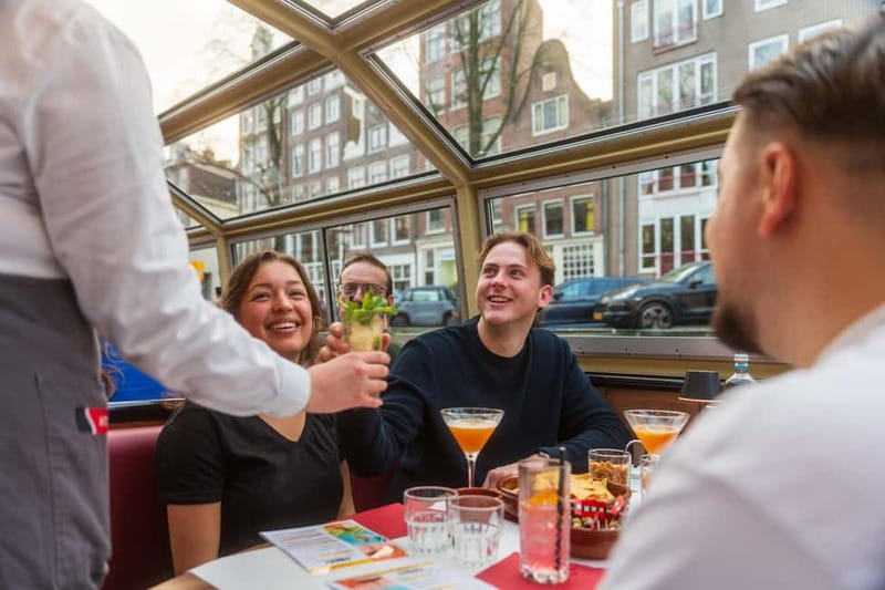 Amsterdam: Unlimited Cocktails Cruise on the Canals - Getting on board at Damrak: what to expect and where to go