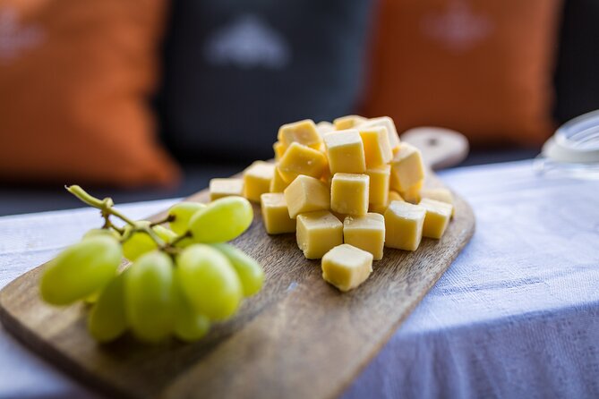 Amsterdam Walking Tour and Cruise with Drinks and Cheese Tasting - Nieuwmarkt and Jodenbuurt: trading, gates, and Jewish neighborhood context