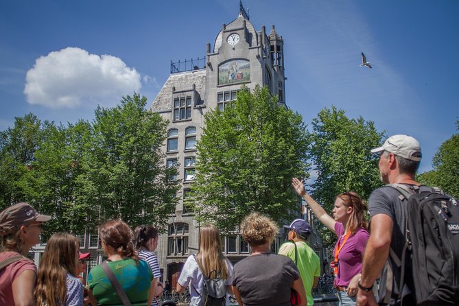Anne Frank Private Bike Tour in Amsterdam - Spinoza Monument and the quick landmark rhythm