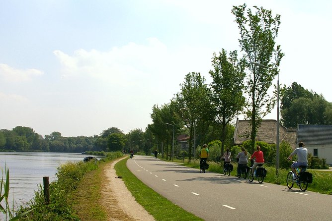 Countryside Bike Tour from Amsterdam: Cheese, Clogs & a Windmill - Cheese and clogs at the family farm: the stop with taste and craft
