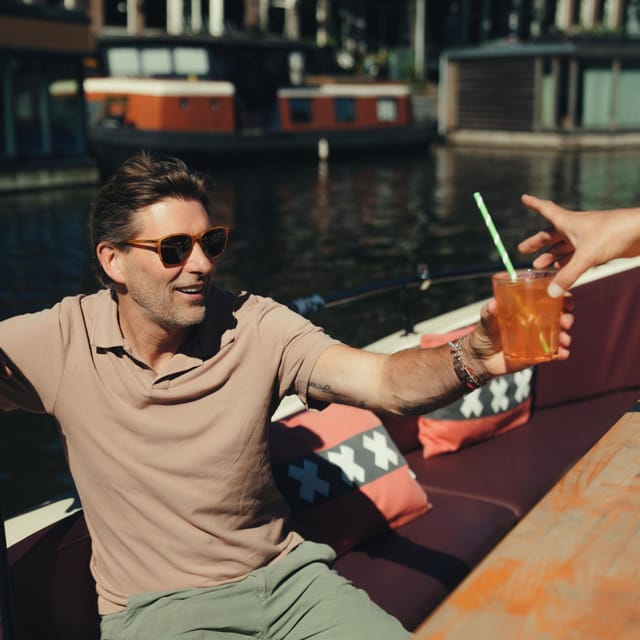 COZY AND FUN CANAL TOUR: A UNIQUE JOURNEY THROUGH AMSTERDAM - Weather day reality: rain can change how you experience Amsterdam