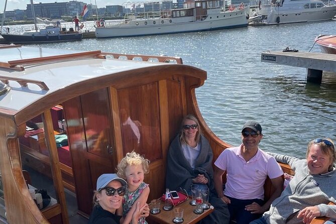 Cruise Amsterdam like a Local — Small Group 12 pax - The heated saloon boat: comfort first, views second (and both happen)