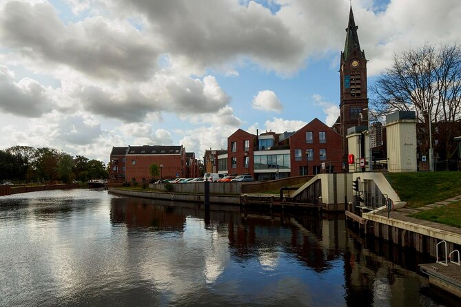 From Amsterdam: Day Trip to Rotterdam, Delft & Hague with Cruise - Delft Blue on the clock: canals, royal tomb links, and a factory visit