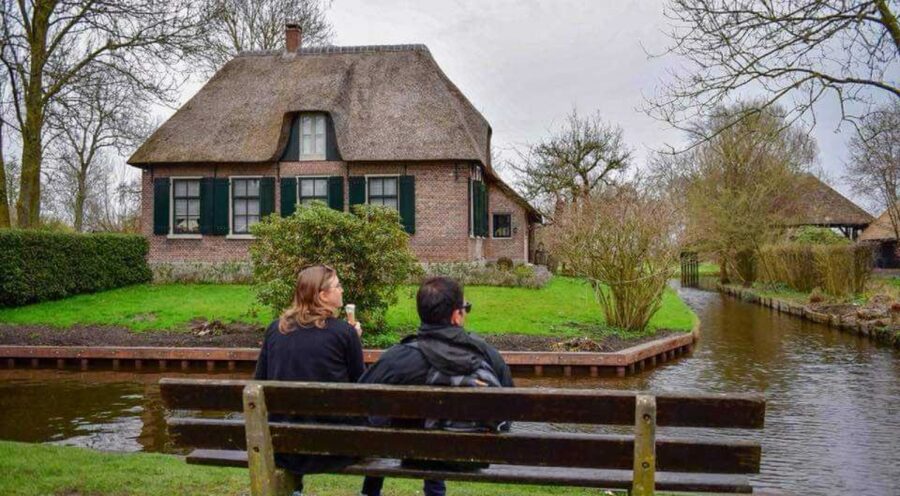 From Amsterdam: Giethoorn Guided Day Trip with Canal Cruise - Food and Extras: stroopwafel, bottled water, and possible farm tastings