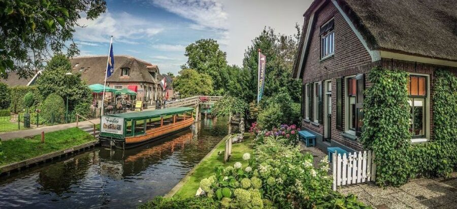 From Amsterdam: Private Tour to Giethoorn with Canal Cruise - Amsterdam hotel pickup and the Mercedes ride north