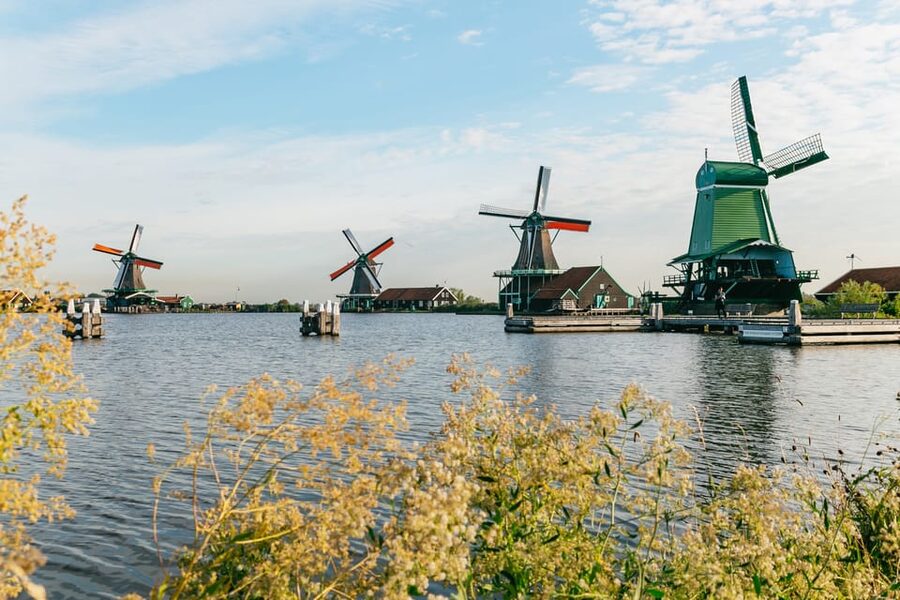 From Amsterdam: Zaanse Schans, Edam, Volendam & Marken - Marken: Wooden Houses, Quiet Harbor Streets, and a Church Symbol