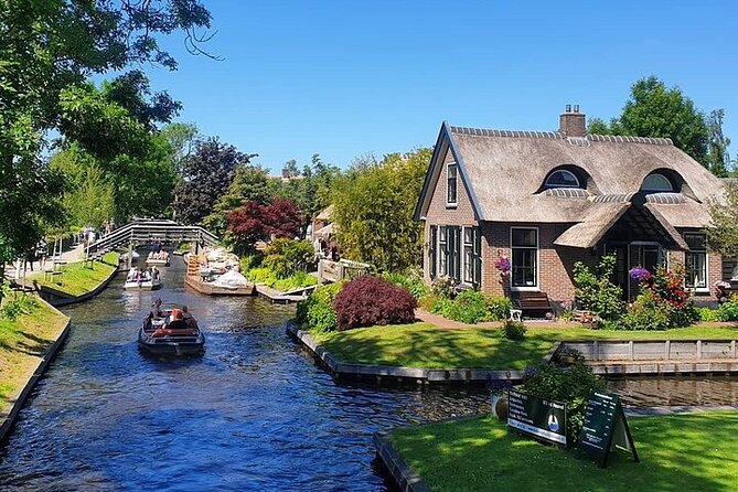 Giethoorn Day Tour from Amsterdam with Small Boat Ride - Getting From Amsterdam to the Village: Meeting Point and Pace