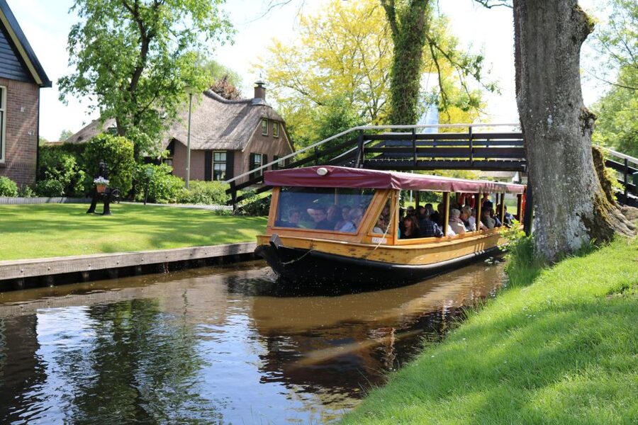 Giethoorn: Village & National Park Canal Cruise with Coffee - Giethoorn from the water: bridges, houses, and quiet photo moments