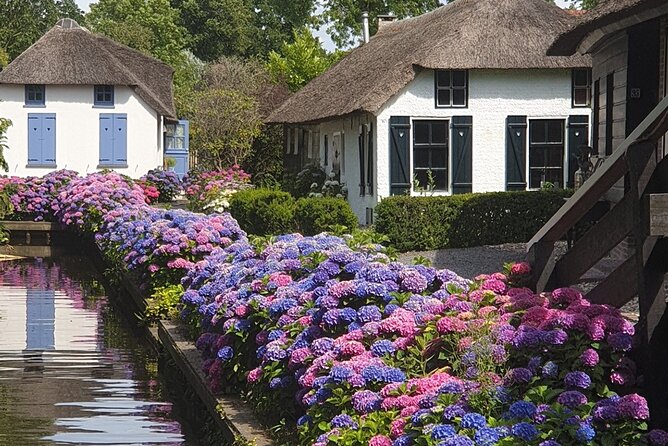 Giethoorn, Zaandam & Zaanse Schans Day Tour w/ Small Boat Ride - Zaanse Schans in Practice: Windmills, Green Houses, Cheese, and Clogs