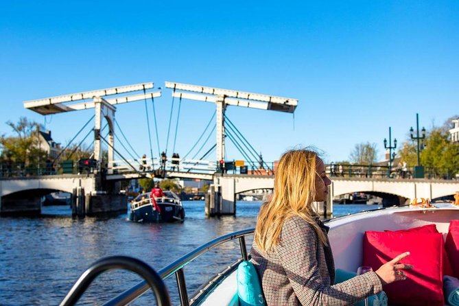 Guided Amsterdam Canal Cruise – Snacks & Drinks on board(1 Hour) - Following the route: old streets, quiet churches, and tiny waterways