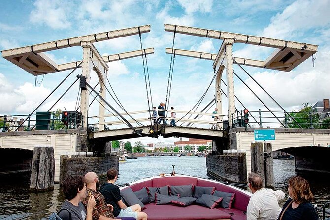 Guided Amsterdam Canal Cruise – Snacks & Drinks on board(1 Hour) - The romantic moments: arch bridges and a kiss-under-bridge legend