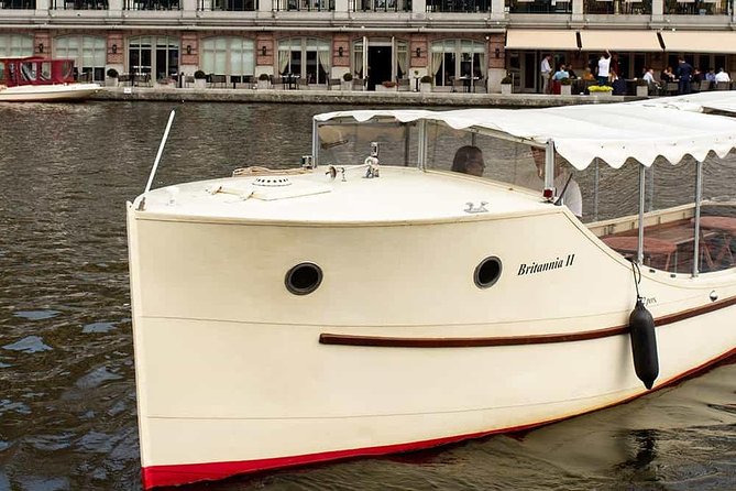 Guided Amsterdam Canal Cruise – Snacks & Drinks on board(1 Hour) - The quirky Amsterdam details: crooked canal houses and medieval walls