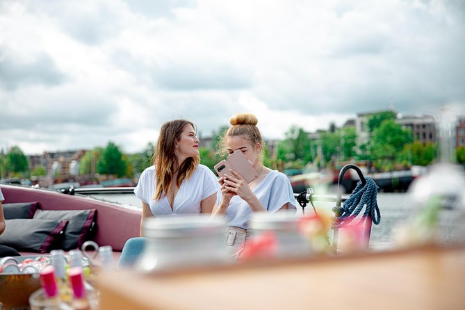 Guided Amsterdam Canal Cruise – Snacks & Drinks on board(1 Hour) - A note on guides: stories, humor, and how much you’ll hear