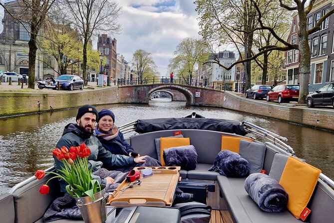 Private 90 Minute Amsterdam Canal Belt Exploration Cruise - Canal architecture stops: Noorderkerk, Westerkerk, and houseboats