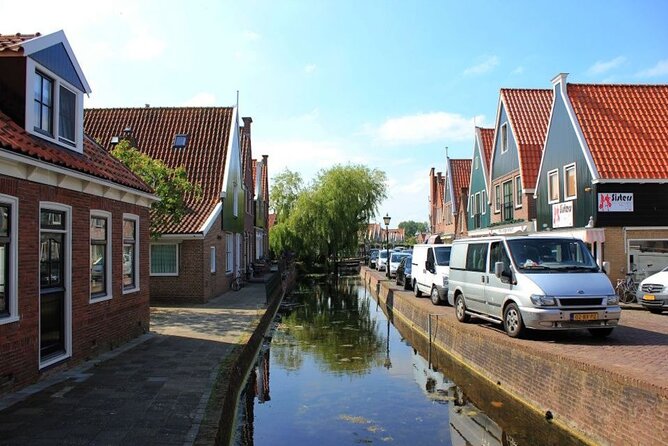 Private Sightseeing Tour to Windmills Cheese Farm and Volendam - Zaanse Schans windmills: wooden shoes, walking time, and classic Dutch scenes