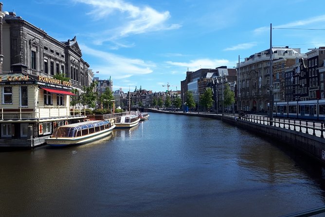 Private Tour: Amsterdam City Walking Tour and Canal Cruise - Albert Cuyp Market finish: shopping street, snack vibes, real local energy