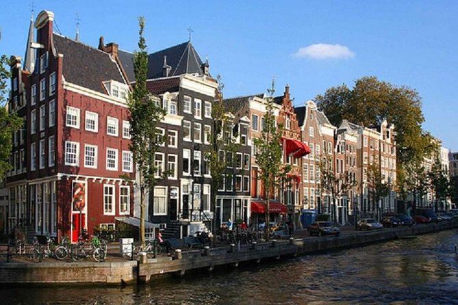 Secrets of Amsterdam Walking Tour plus Dutch Sweets Tasting - Begijnhof: the calm courtyard that makes the city feel human