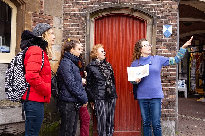 Small Group LGBTQ+ History Tour in Amsterdam - Stop 2 Munttoren (Munt Tower): A Shopkeeper’s Fight Against State Violence