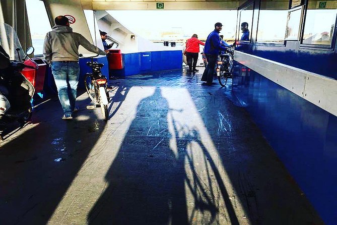 Urban Adventures Amsterdam Bike Tour, Graffiti and Magnet Fishing - Pontsteiger ferry: switching to the North Amsterdam feel
