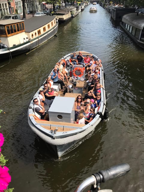 Visit Amsterdam by Boat with a French Guide (french) - A French Apéro on a Small Electric Boat